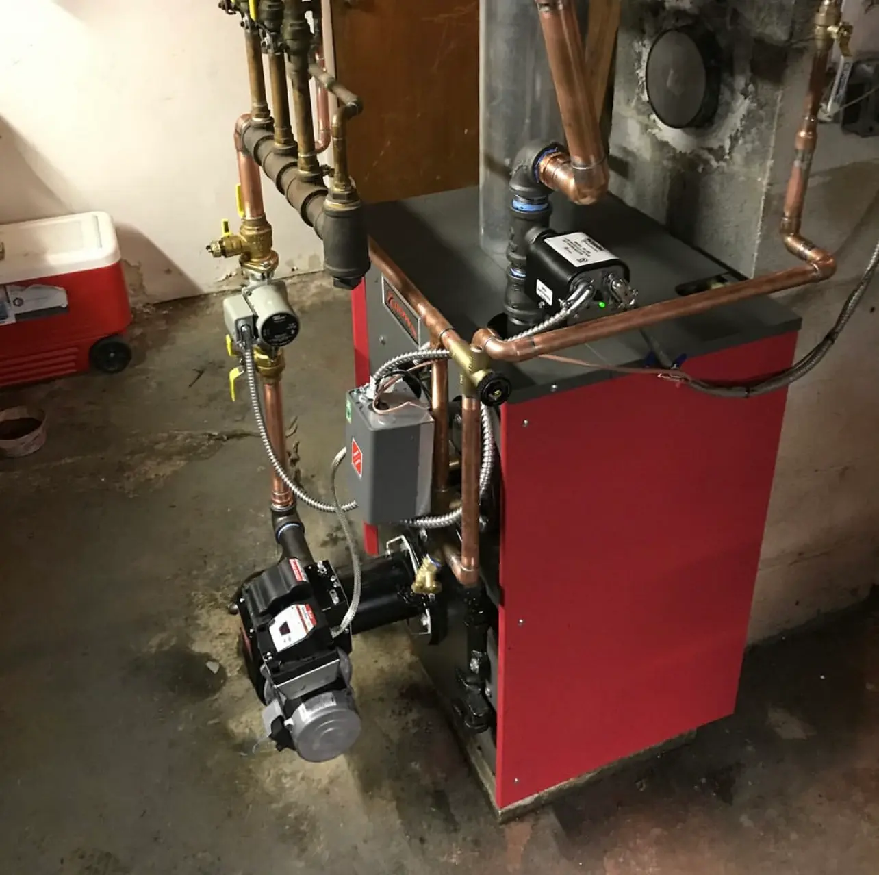 Boiler in a basement mechanical room serviced by Classic Climate Controls